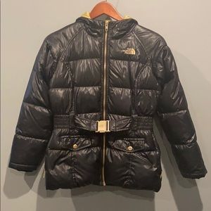 The north face girl black with gold detail puffer